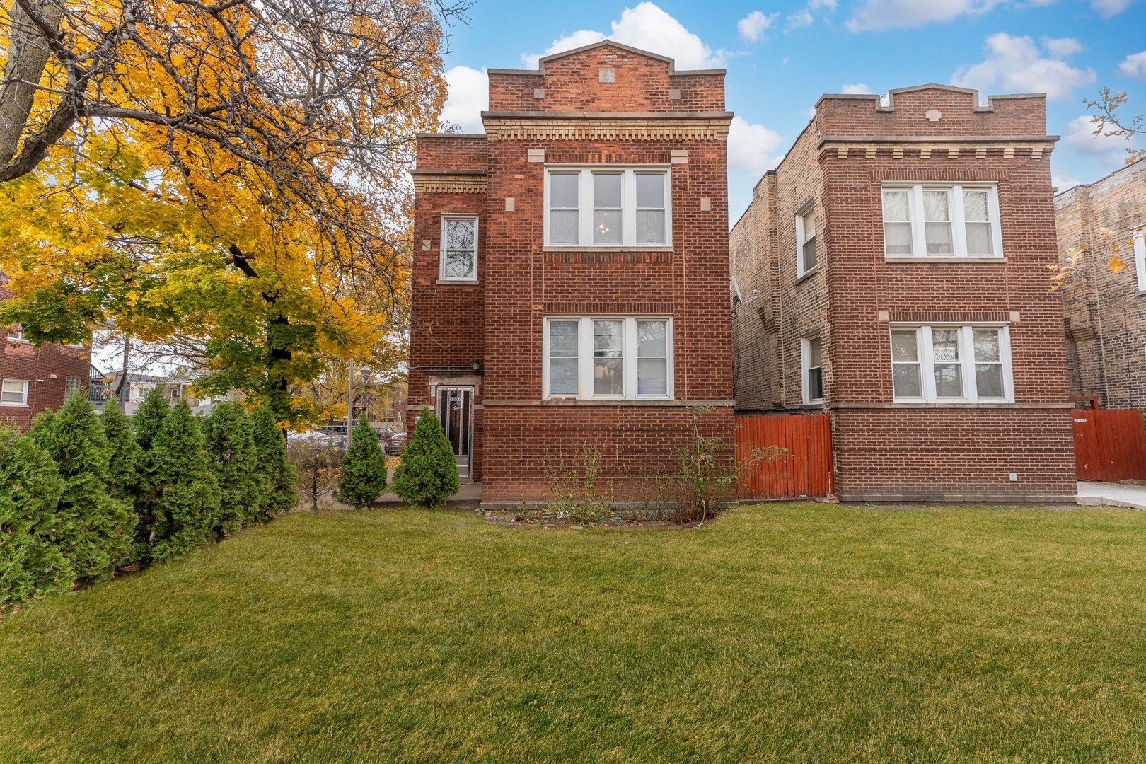 1657 North Austin Avenue Chicago, IL 60639 - Photo 1 of 36 a front view of a house with a yard