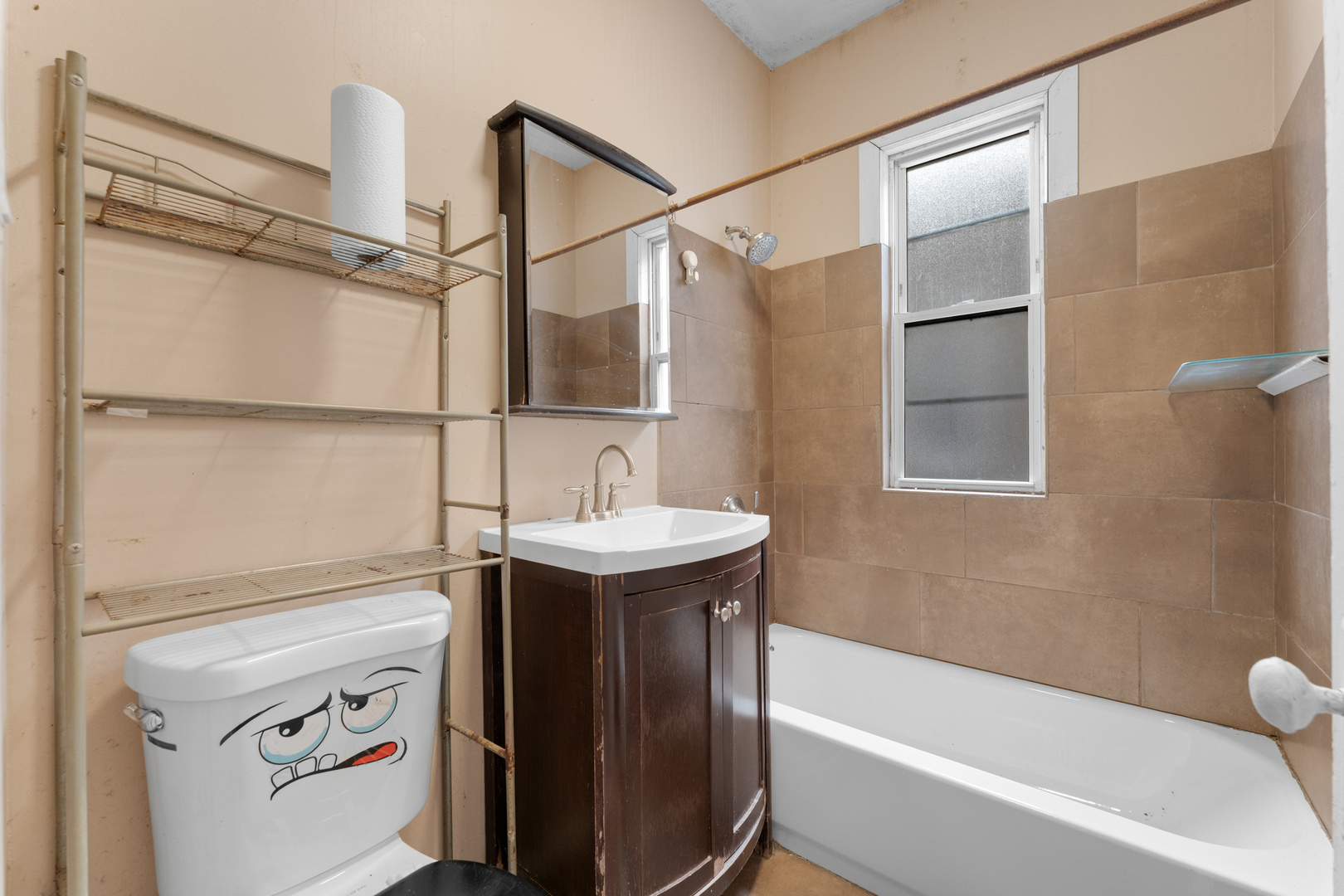 1657 North Austin Avenue Chicago, IL 60639 - Photo 11 of 36 a bathroom with a sink a vanity and shower