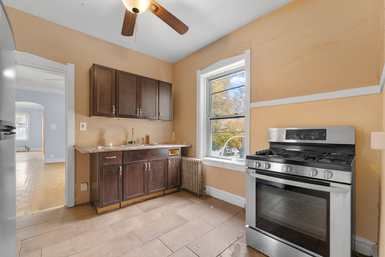 1657 North Austin Avenue Chicago, IL 60639 - Photo 13 of 36 a kitchen with stainless steel appliances granite countertop a stove and a sink