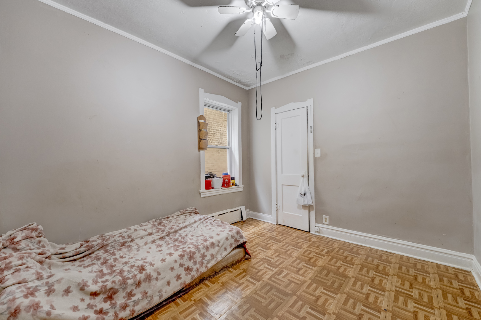 1657 North Austin Avenue Chicago, IL 60639 - Photo 22 of 36 a bedroom with bed and a window