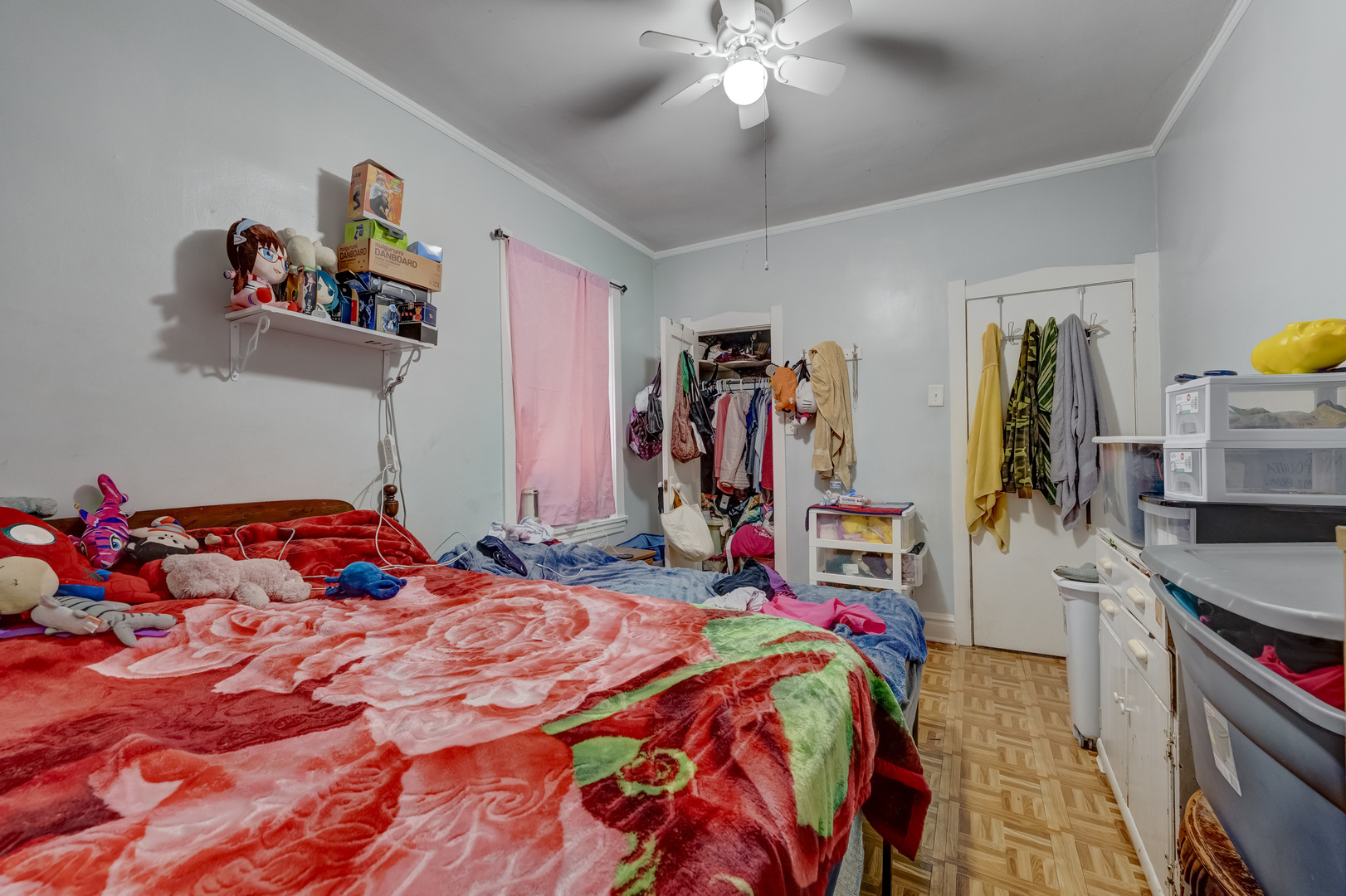 1657 North Austin Avenue Chicago, IL 60639 - Photo 24 of 36 a bedroom with a bed and a chandelier