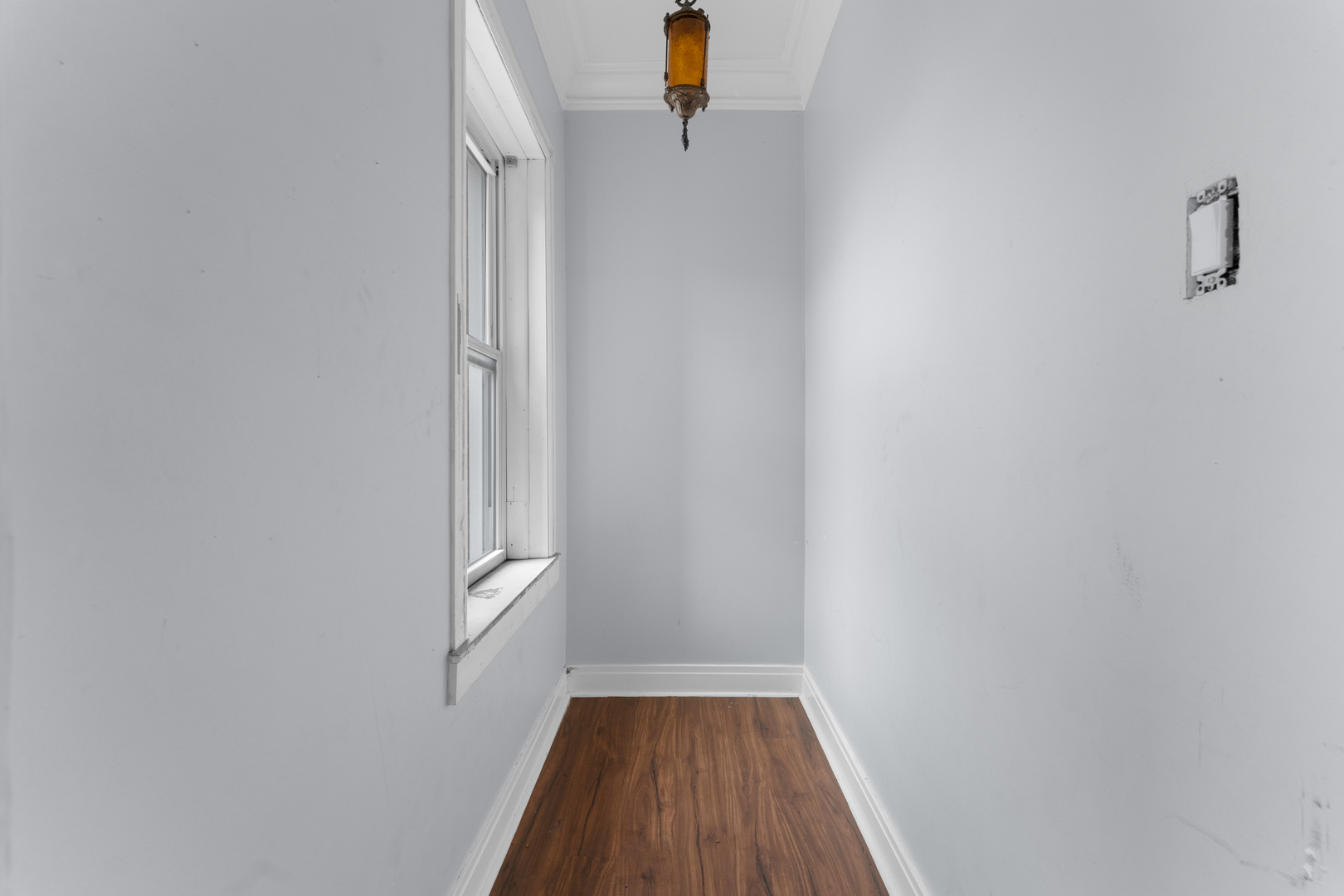 1657 North Austin Avenue Chicago, IL 60639 - Photo 7 of 36 a view of a hallway with wooden floor and staircase
