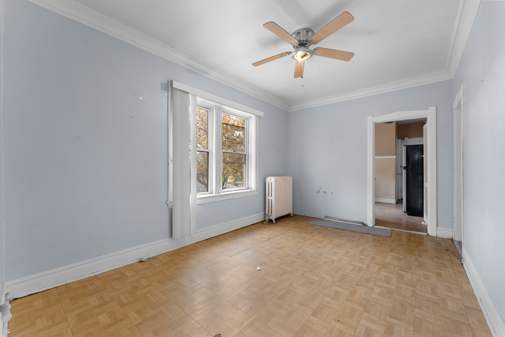 1657 North Austin Avenue Chicago, IL 60639 - Photo 8 of 36 an empty room with fan and windows