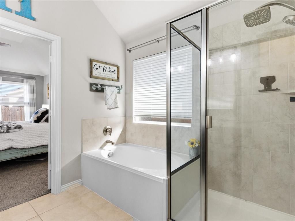 419 George Drive Fate, TX 75189 - Photo 16 of 26 a bathroom with a tub and shower