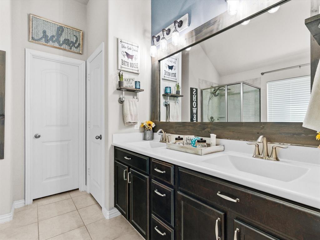 419 George Drive Fate, TX 75189 - Photo 18 of 26 a bathroom with a sink double vanity and a mirror
