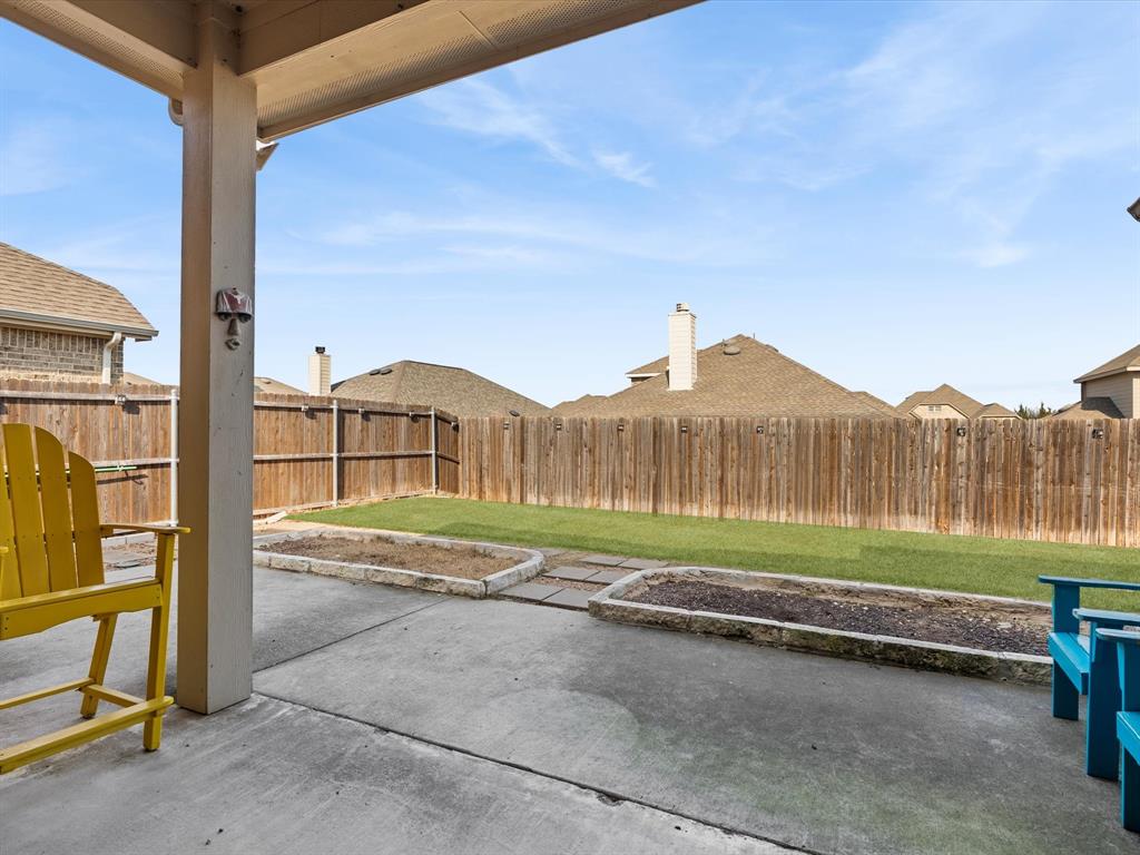 419 George Drive Fate, TX 75189 - Photo 24 of 26 a view of a backyard with table and chairs