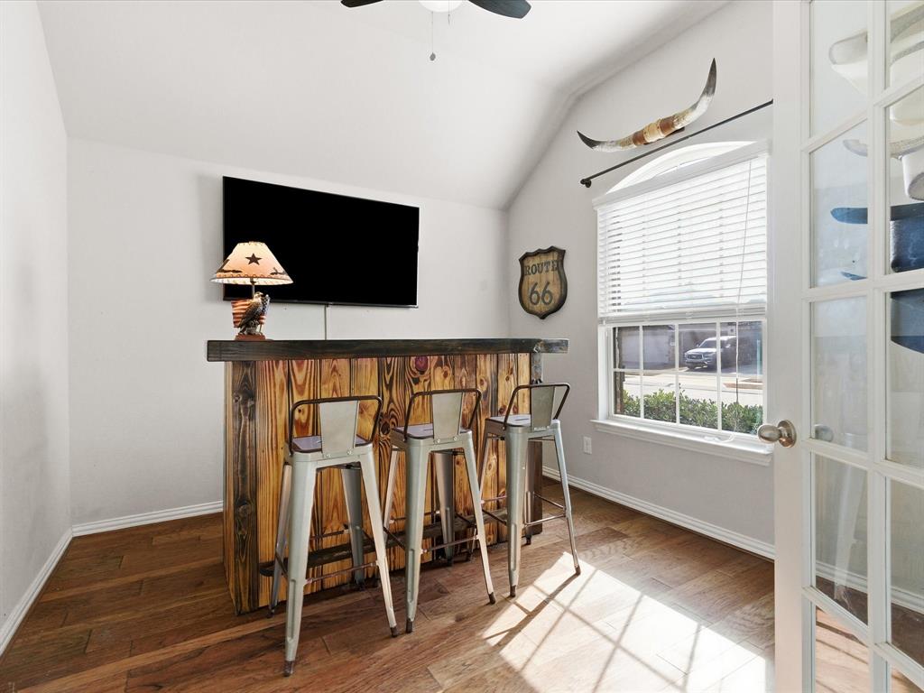 419 George Drive Fate, TX 75189 - Photo 4 of 26 a livingroom with a window and a flat screen tv