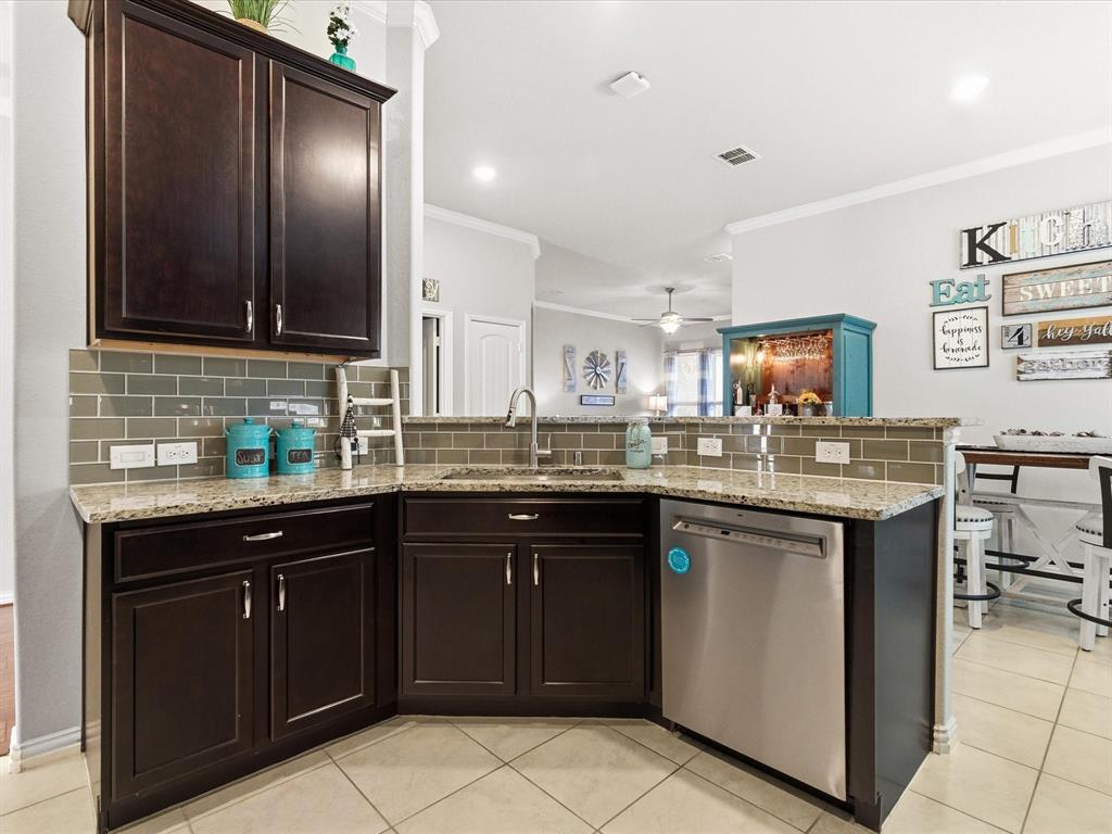 419 George Drive Fate, TX 75189 - Photo 8 of 26 a kitchen with a sink and cabinets