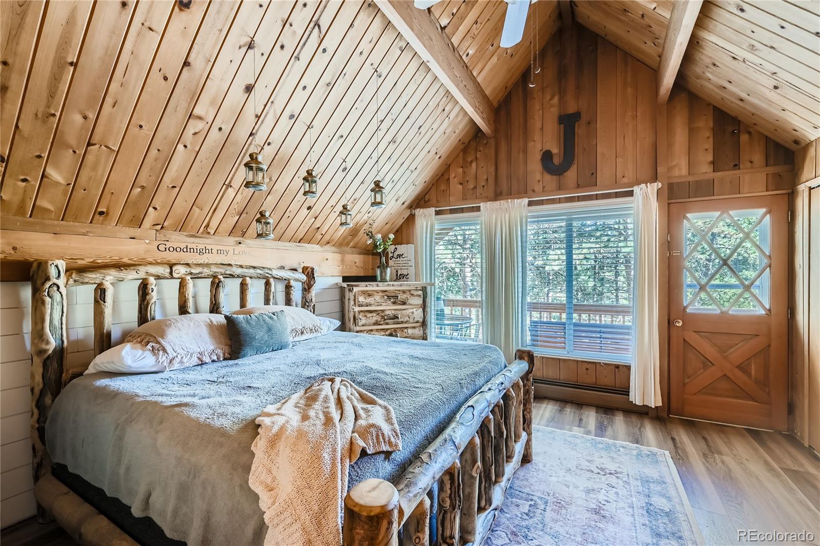 938 Valley Road Evergreen, CO 80439 - Photo 13 of 24 a bed sitting in a bedroom next to a window