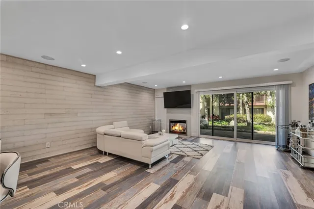 a living room with furniture fireplace and a flat screen tv