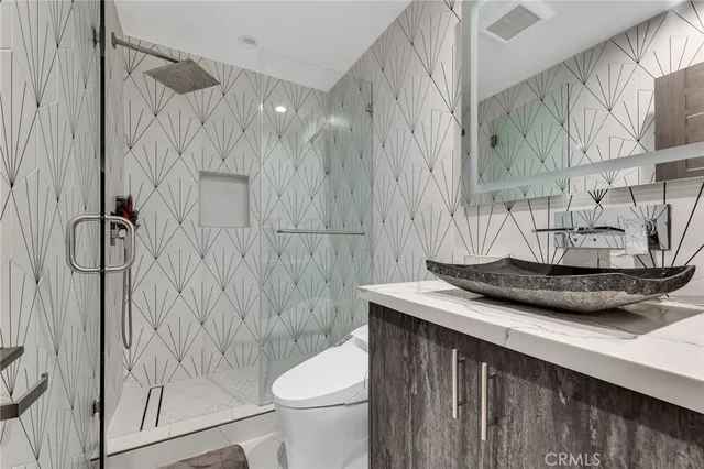 a view of bathroom with a sink and toilet