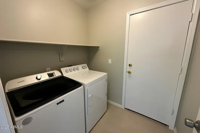 a utility room with dryer and washer