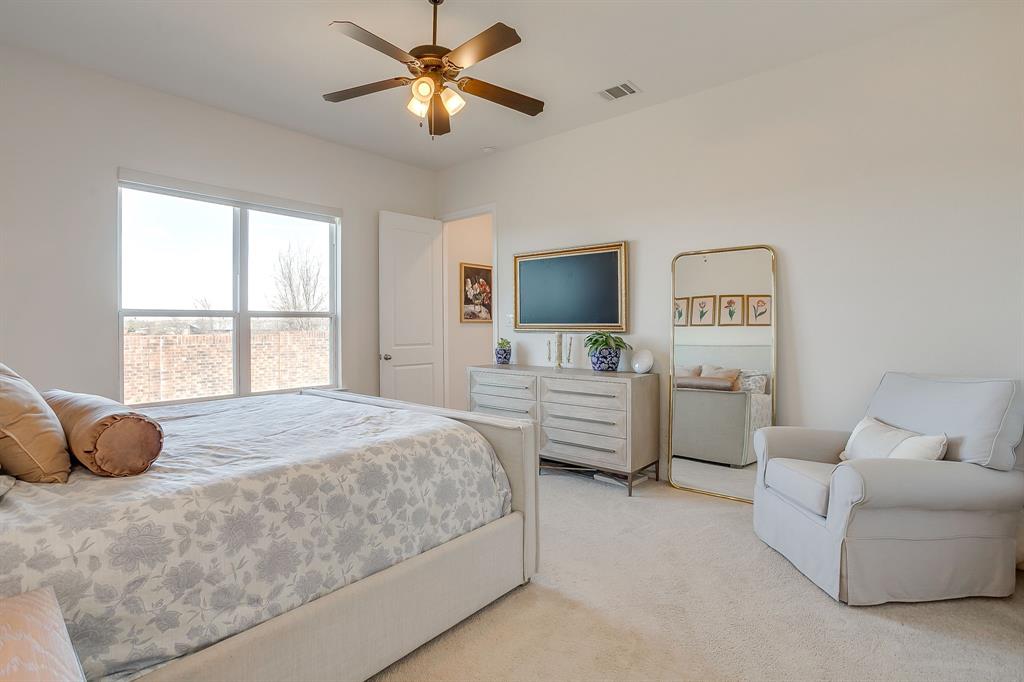 208 Observation Drive West Aledo, TX 76008 - Photo 12 of 23 a bedroom with a bed and a flat screen tv