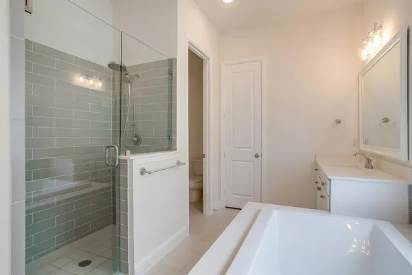 a bathroom with a bathtub and a shower