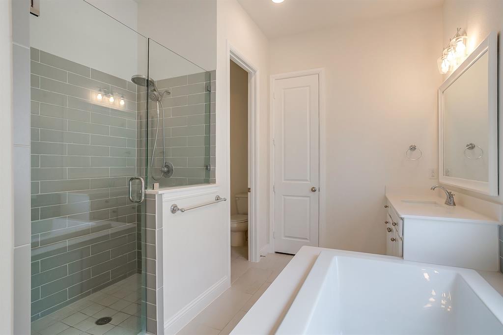 208 Observation Drive West Aledo, TX 76008 - Photo 14 of 23 a bathroom with a bathtub and a shower