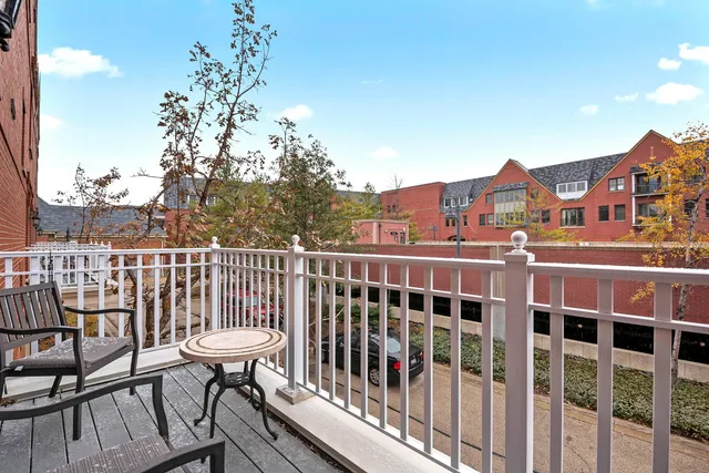 a view of a balcony with chairs