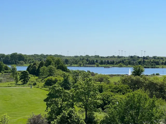 a view of a lake with houses in the back