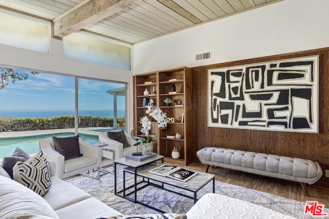 1126 Tellem Drive Pacific Palisades, CA 90272 - Photo 14 of 46 a living room with furniture and a window