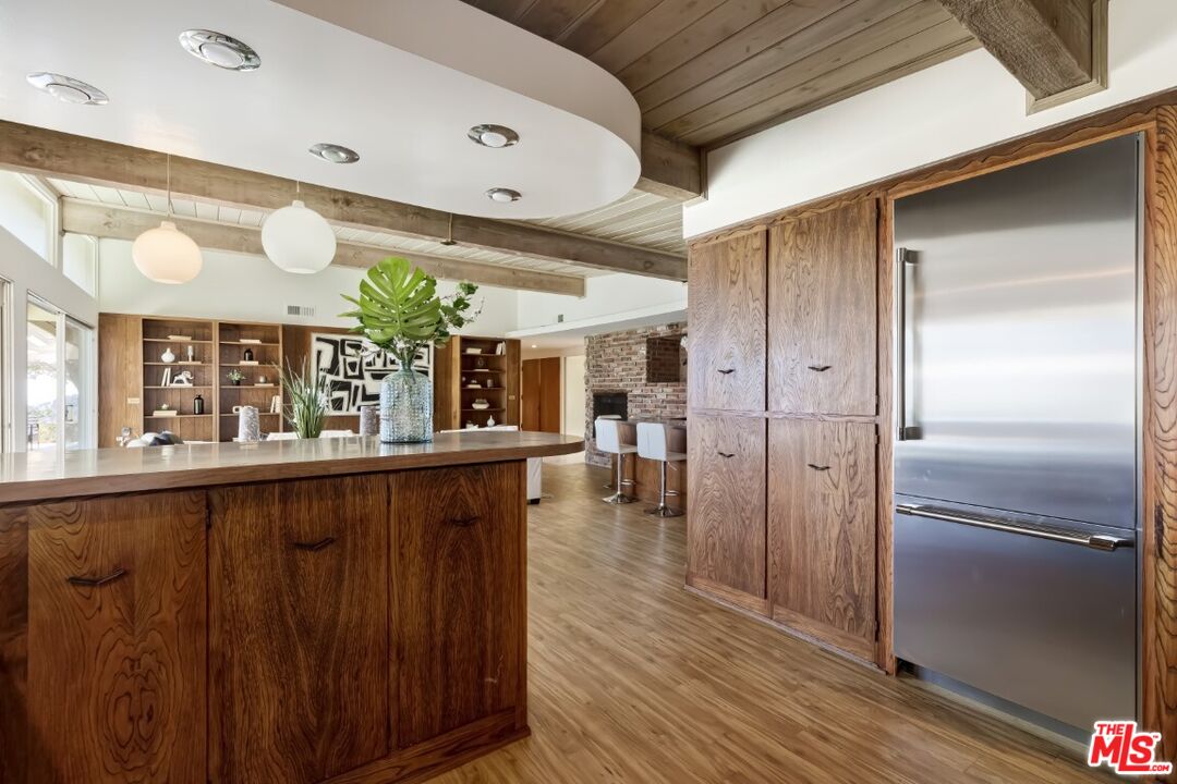 1126 Tellem Drive Pacific Palisades, CA 90272 - Photo 21 of 46 a kitchen with stainless steel appliances granite countertop a refrigerator and a sink