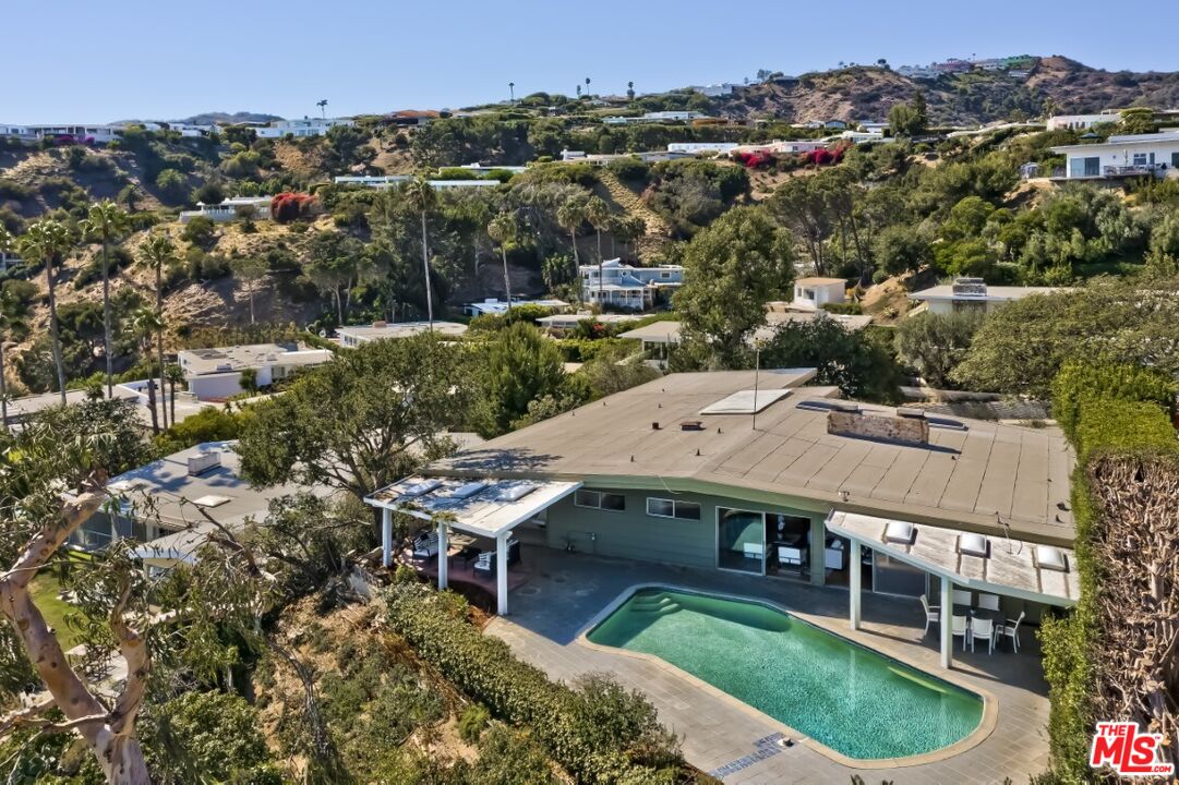 1126 Tellem Drive Pacific Palisades, CA 90272 - Photo 4 of 46 an aerial view of a house with a garden