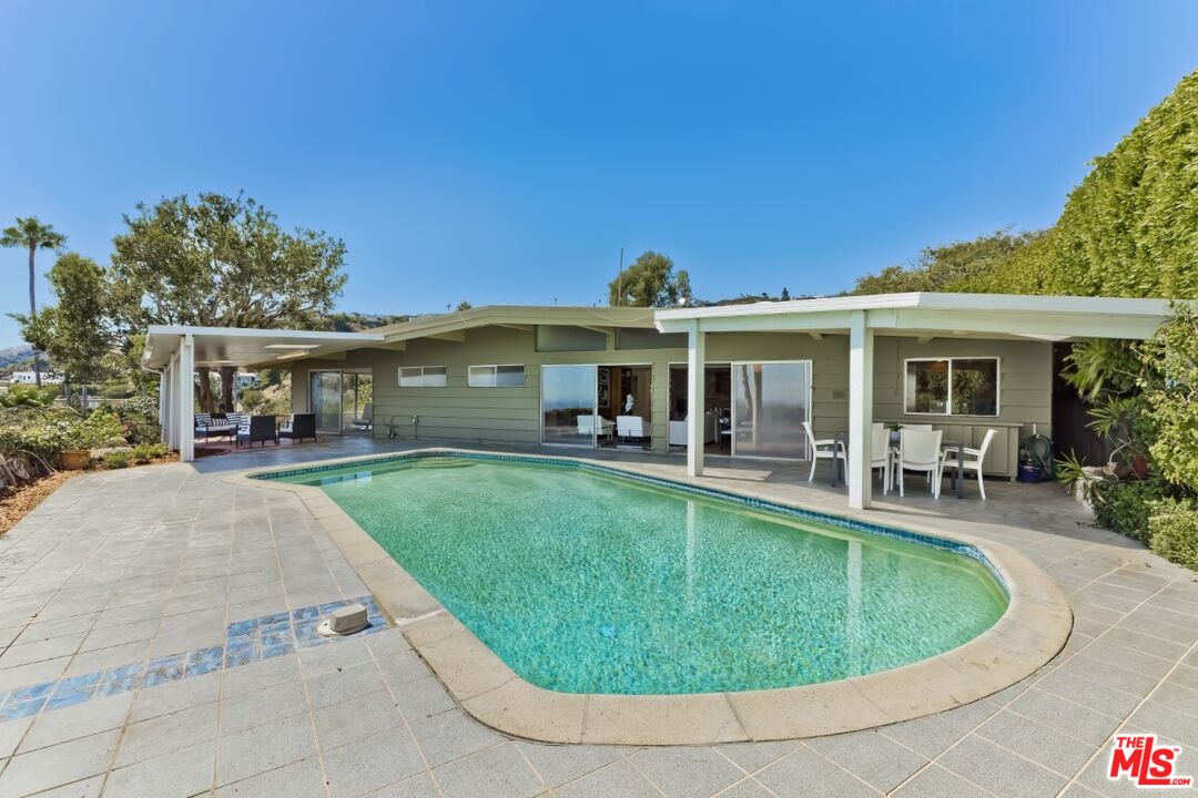 1126 Tellem Drive Pacific Palisades, CA 90272 - Photo 44 of 46 a view of a house with swimming pool and sitting area