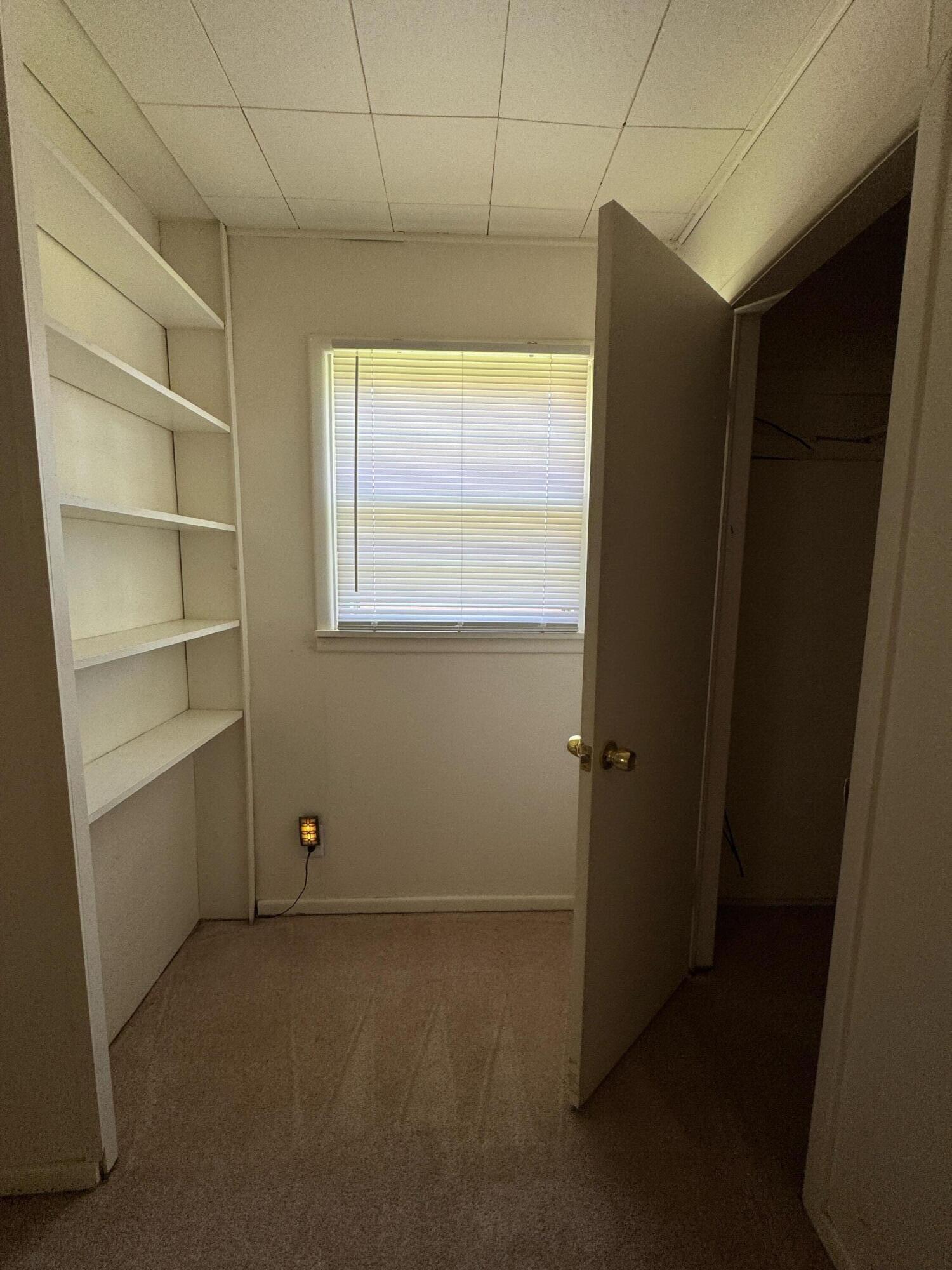 955 South 20th Street Slaton, TX 79364 - Photo 12 of 14 a view of an empty room with a window