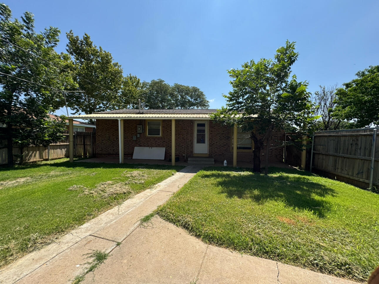 955 South 20th Street Slaton, TX 79364 - Photo 13 of 14 a view of a house with a yard