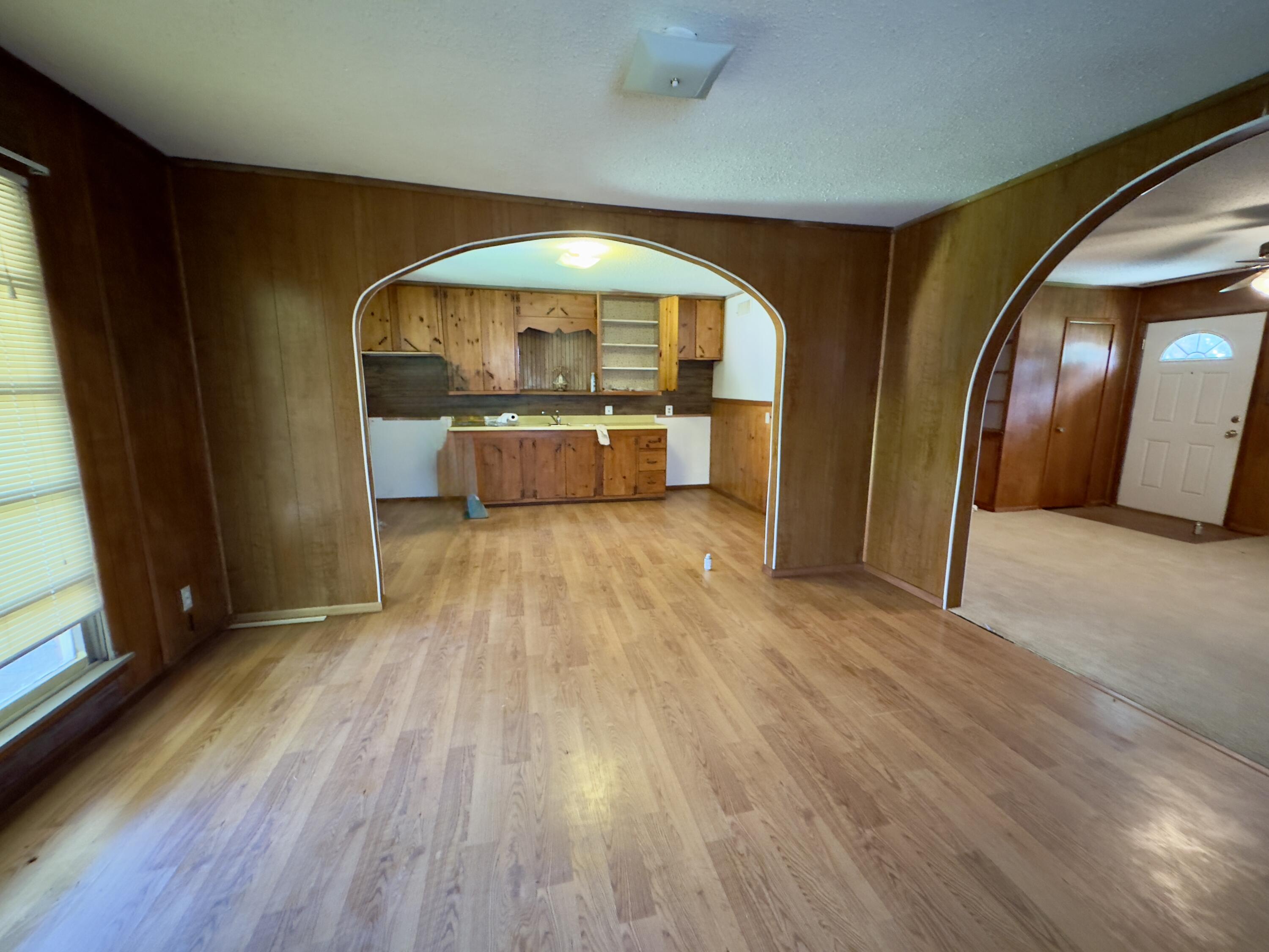 955 South 20th Street Slaton, TX 79364 - Photo 7 of 14 a view of a hallway with wooden floor