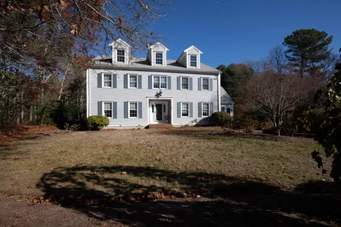 a front view of a house with a yard