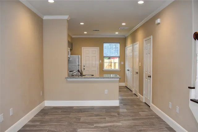 a view of a kitchen cabinets and wooden floor
