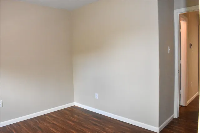 a view of a small space with wooden floor