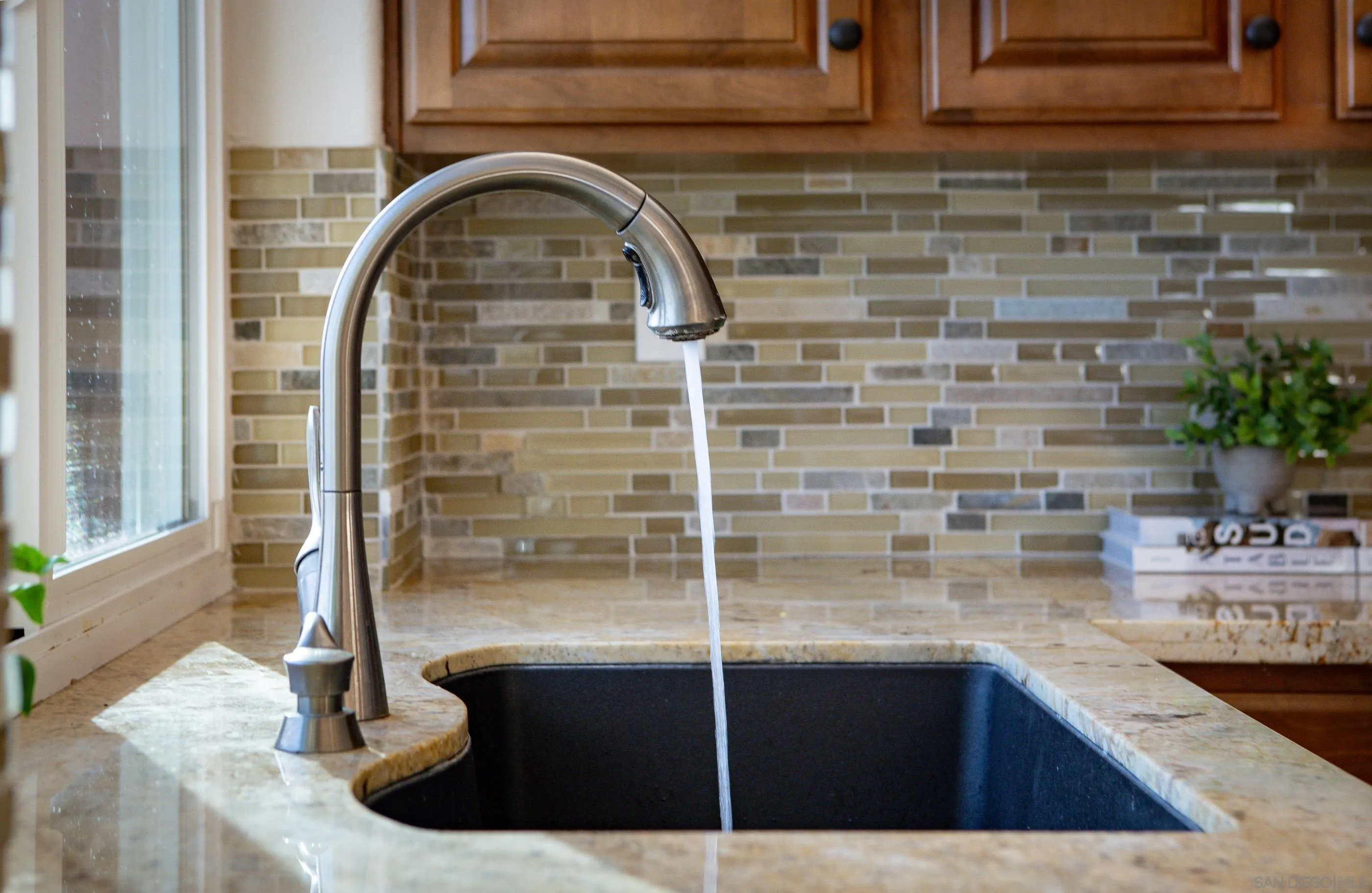 2347 Terraza Ribera Carlsbad, CA 92009 - Photo 14 of 42 a view of kitchen with sink and natural light