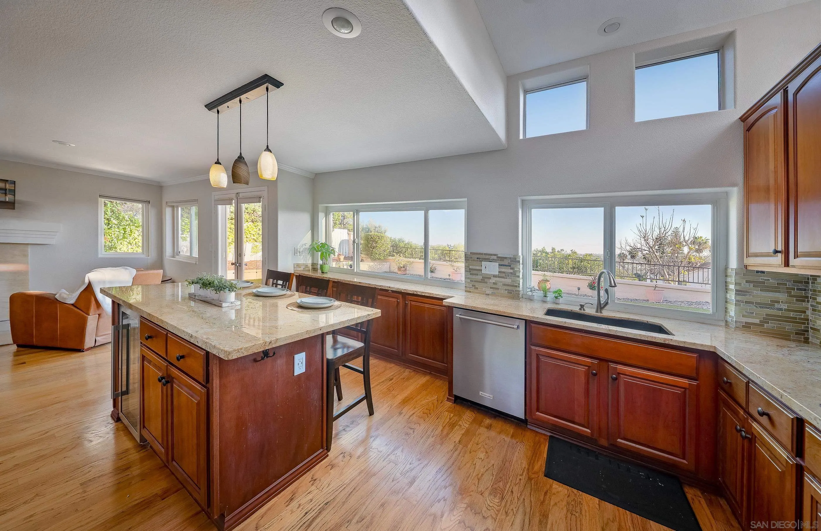 2347 Terraza Ribera Carlsbad, CA 92009 - Photo 15 of 42 a kitchen with a stove and a wooden floors