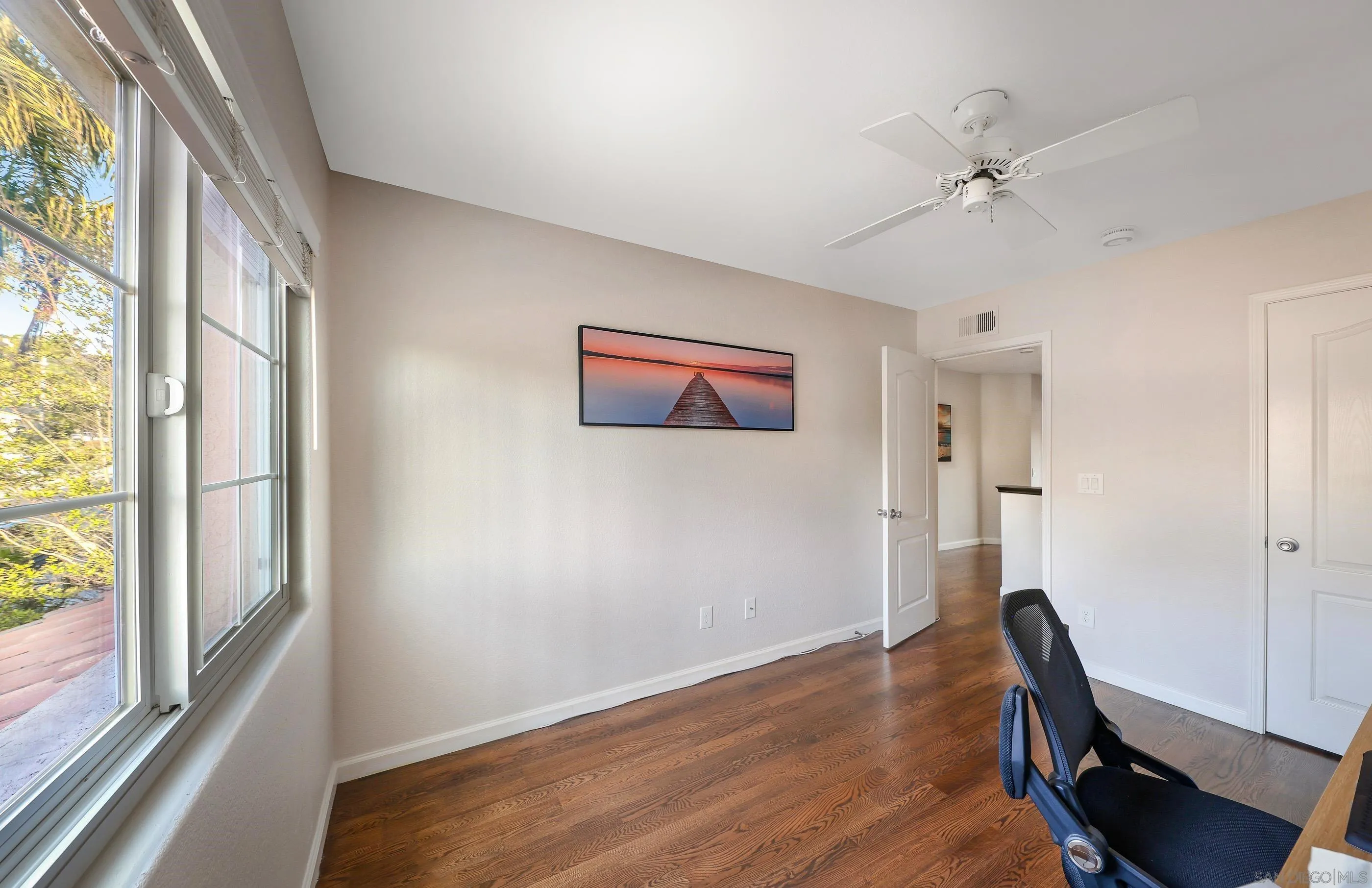 2347 Terraza Ribera Carlsbad, CA 92009 - Photo 24 of 42 wooden floor in an empty room with a window