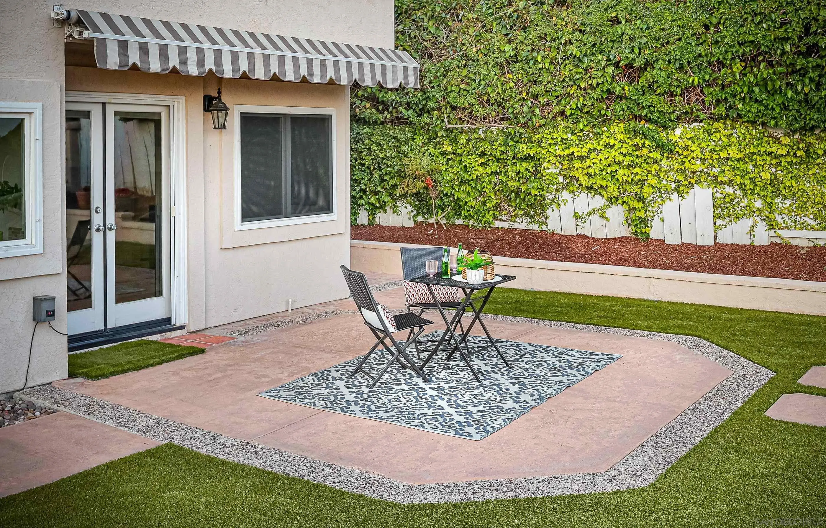 2347 Terraza Ribera Carlsbad, CA 92009 - Photo 29 of 42 a table and chairs in the garden