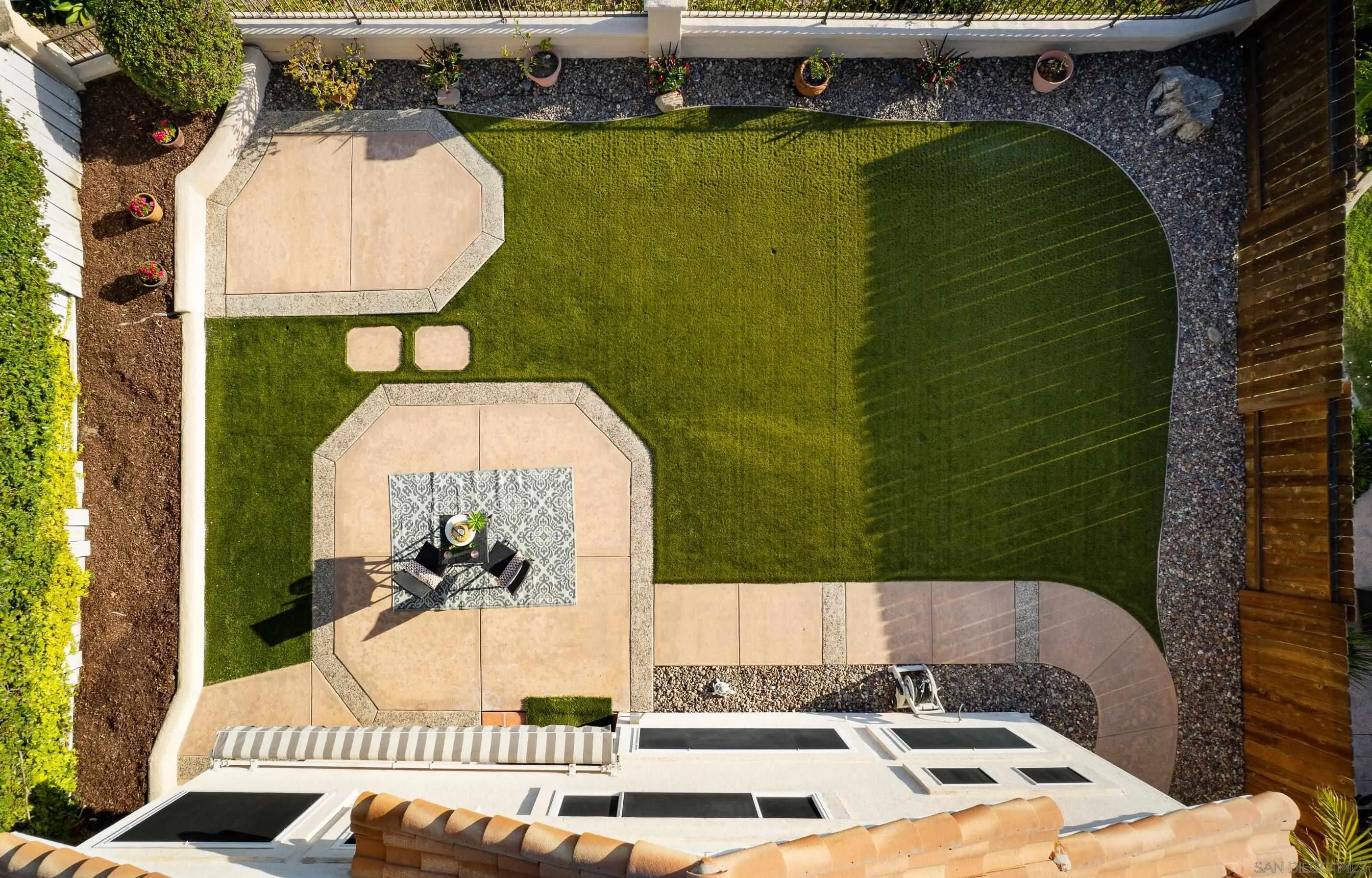 2347 Terraza Ribera Carlsbad, CA 92009 - Photo 31 of 42 a picture of a table and chairs in the patio