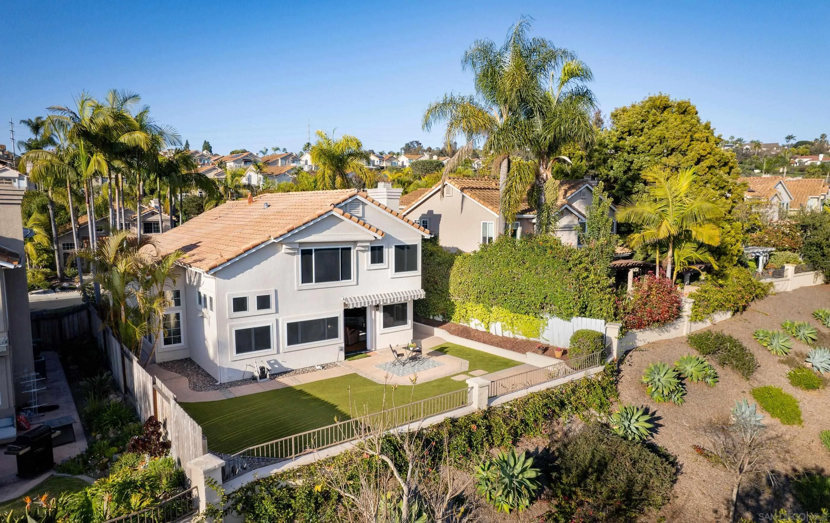 2347 Terraza Ribera Carlsbad, CA 92009 - Photo 34 of 42 a house with swimming pool in front of it