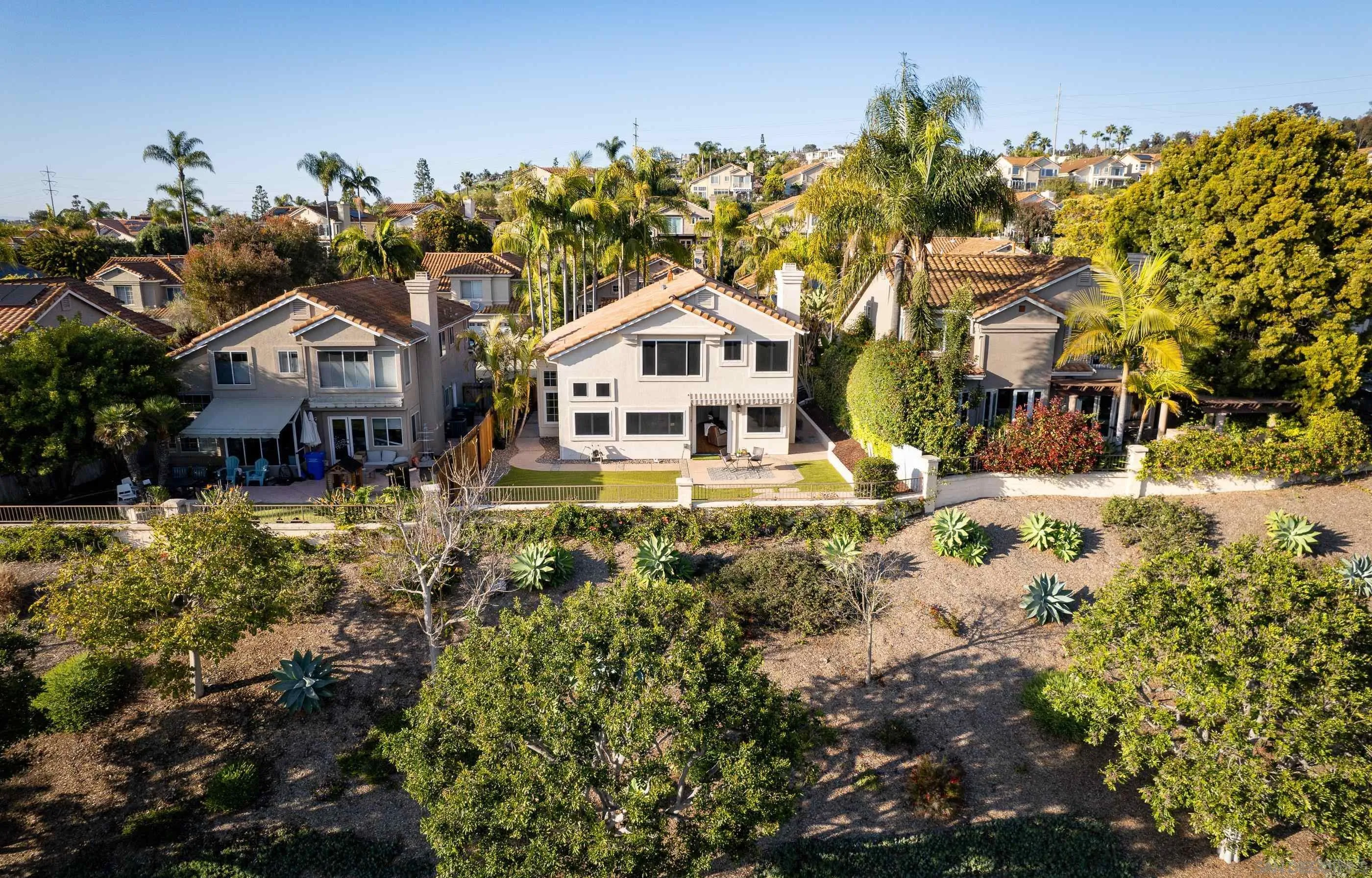 2347 Terraza Ribera Carlsbad, CA 92009 - Photo 35 of 42 a front view of a house with a yard covered with snow