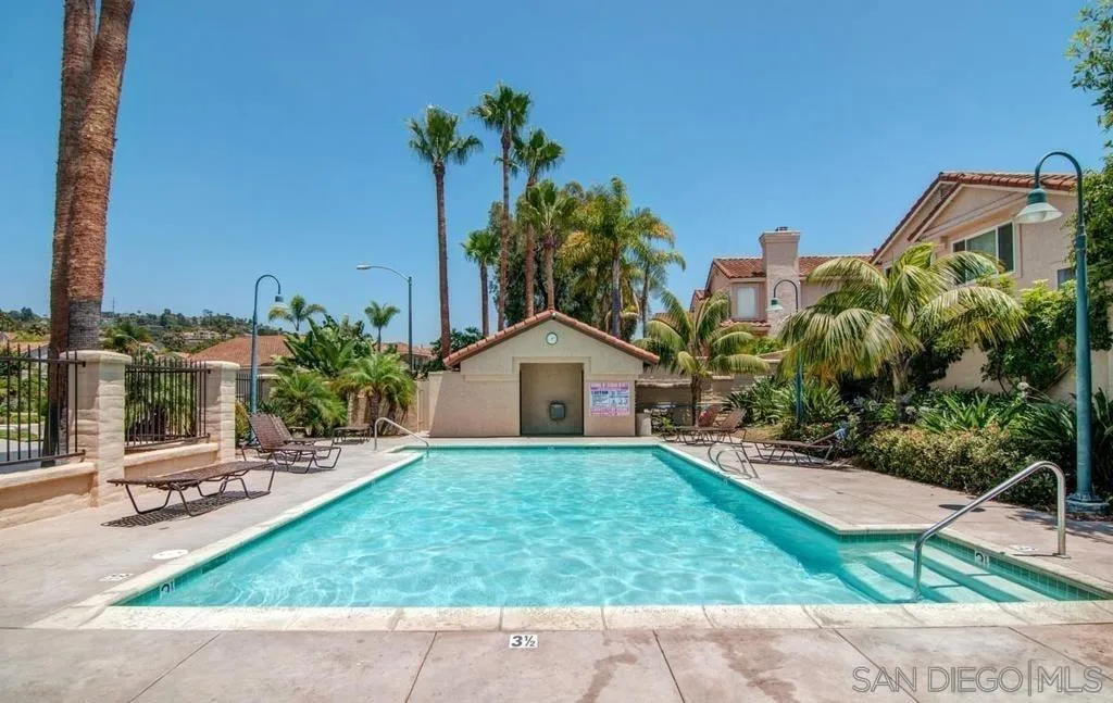 2347 Terraza Ribera Carlsbad, CA 92009 - Photo 40 of 42 a view of a garden with a bench and some trees