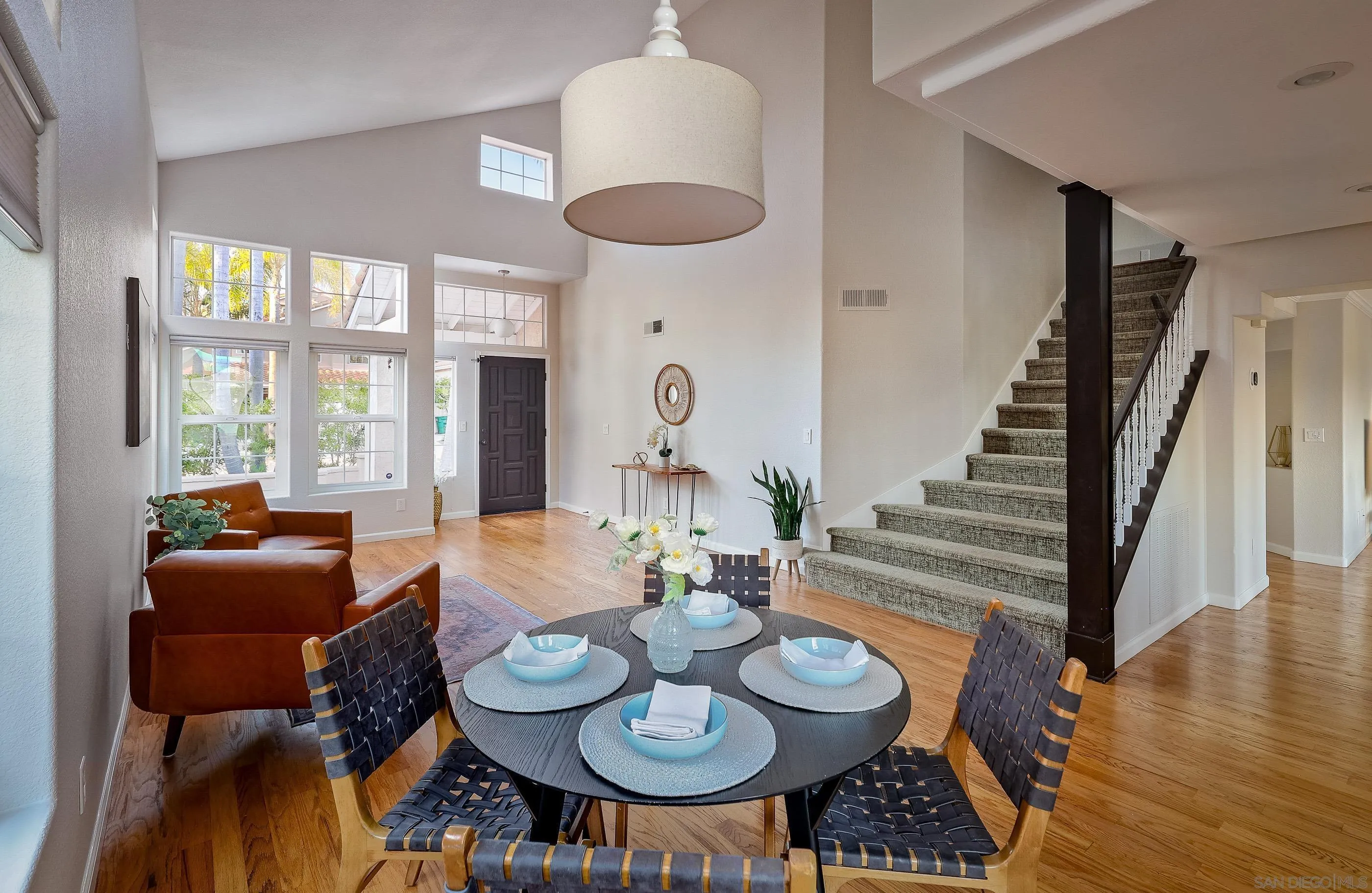 2347 Terraza Ribera Carlsbad, CA 92009 - Photo 7 of 42 a view of a dining room with furniture wooden floor and chandelier