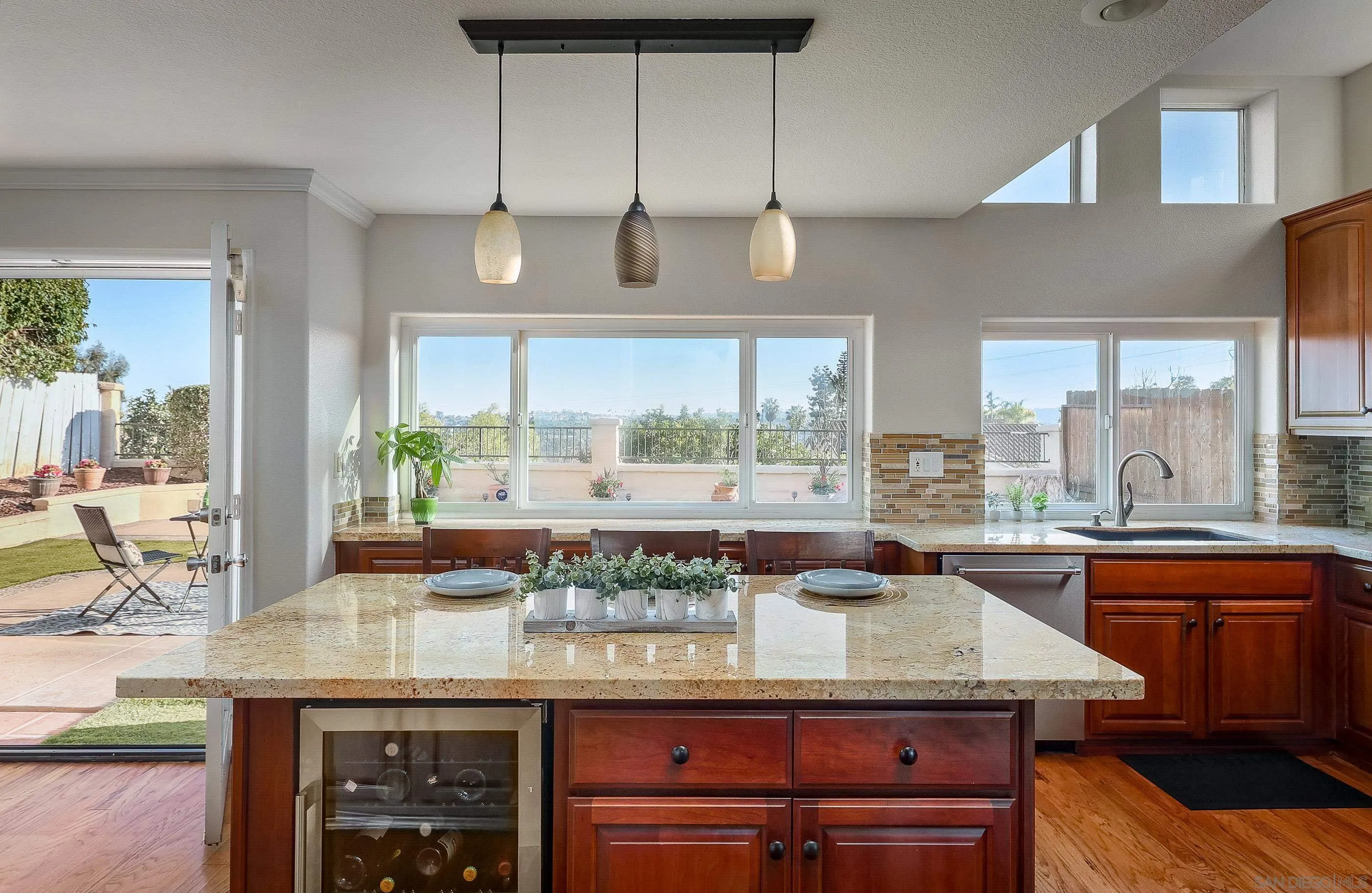 2347 Terraza Ribera Carlsbad, CA 92009 - Photo 10 of 42 a kitchen with a large counter top space appliances and cabinets