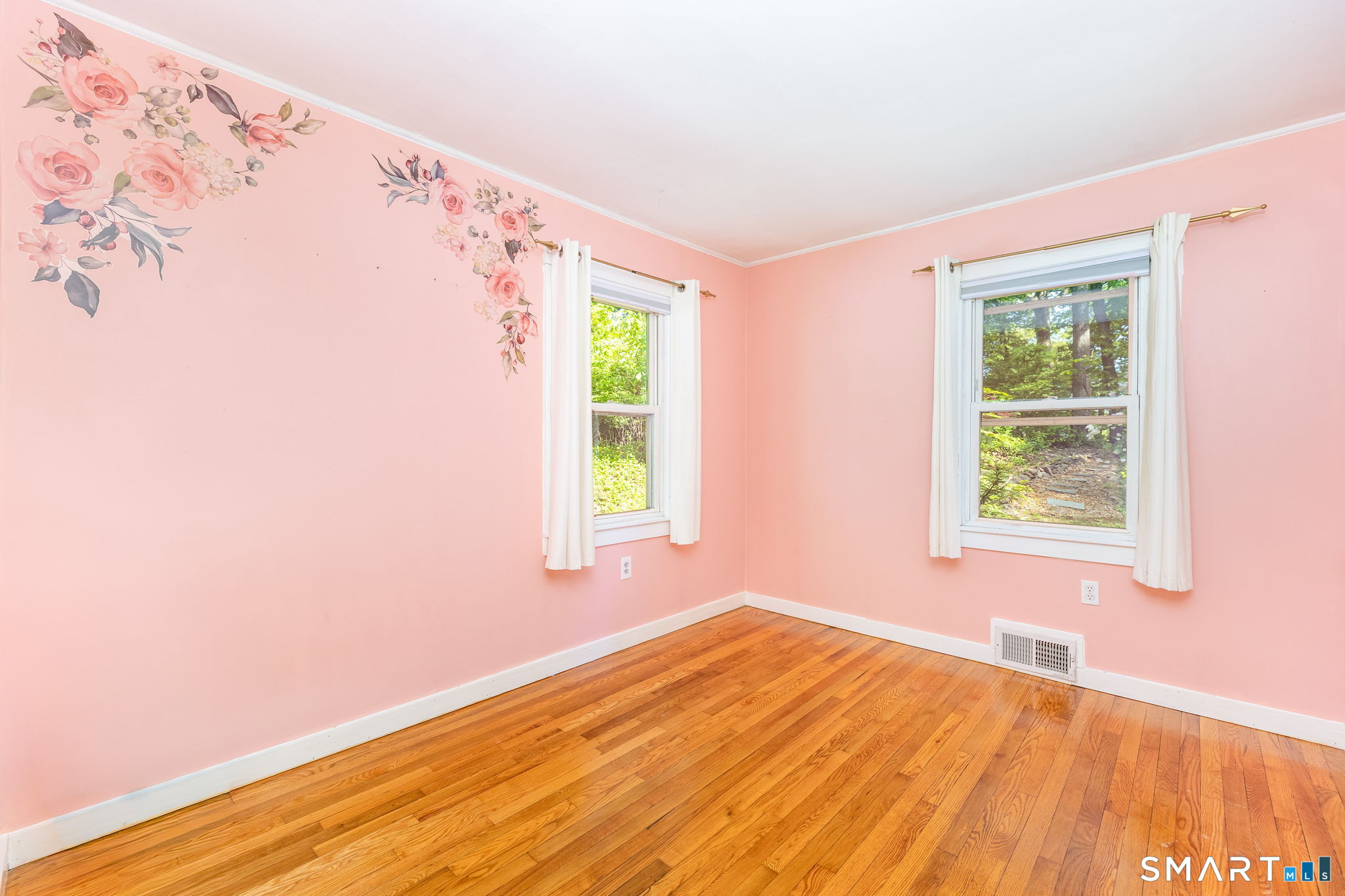 347 Griffin Road Suffield, CT 06093 - Photo 20 of 35 a view of an empty room with wooden floor and a window