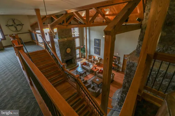 a living room with fireplace furniture and a fireplace