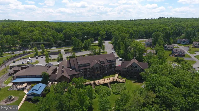 an aerial view of a house with a garden