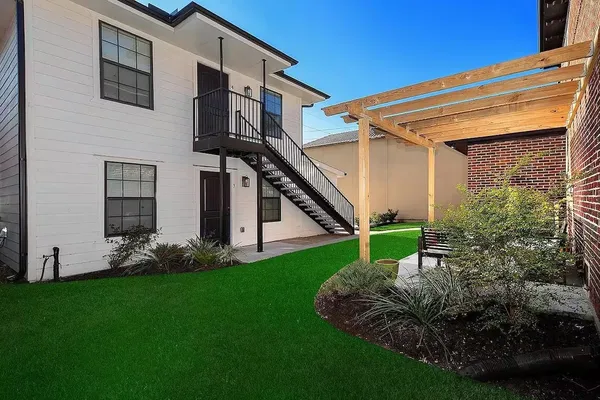 a view of a house with a yard and plants