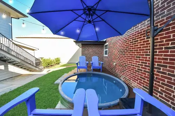 a view of a balcony with table and chairs