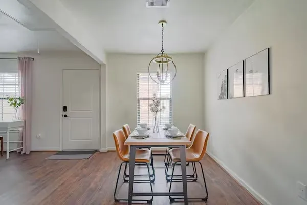 a view of a dining room with furniture window and wooden floor