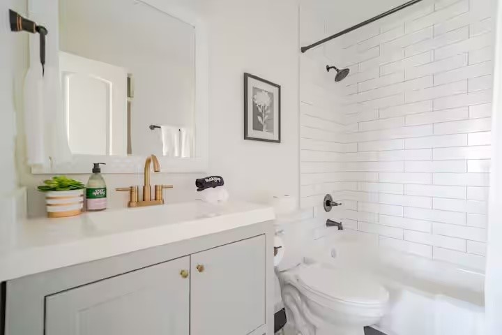 1912 Arbor Street, Unit 3 Houston, TX 77004 - Photo 10 of 24 a bathroom with a sink a toilet and shower