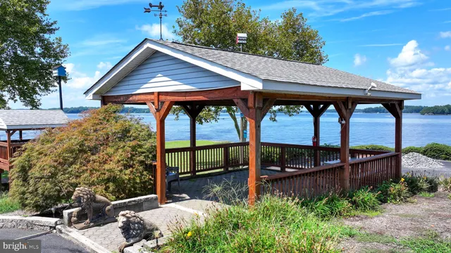 a view of a chairs and table in the roof deck