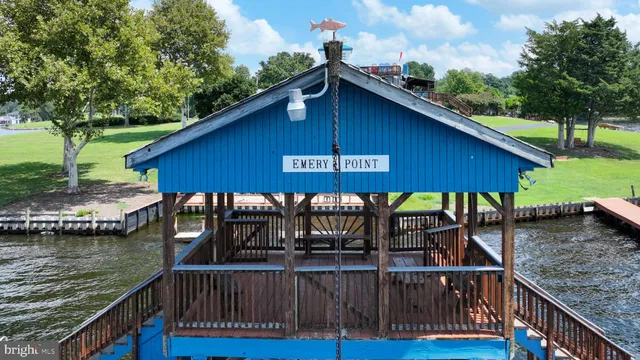 a view of a house with swimming pool and porch with furniture